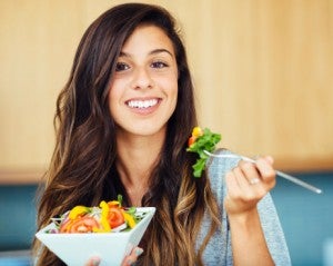 Woman eating salad